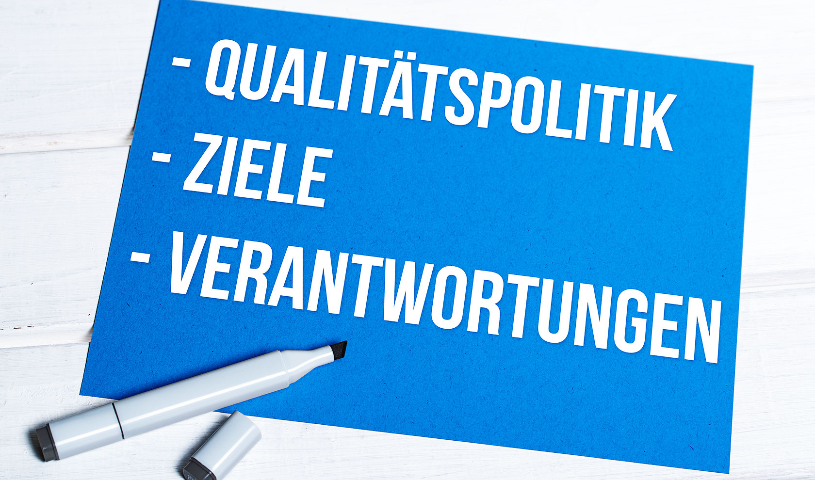 Qualitätspolitik Frankonia-Hydraulik, Ziele, Verantwortungen, blaues Schildchen, Stift